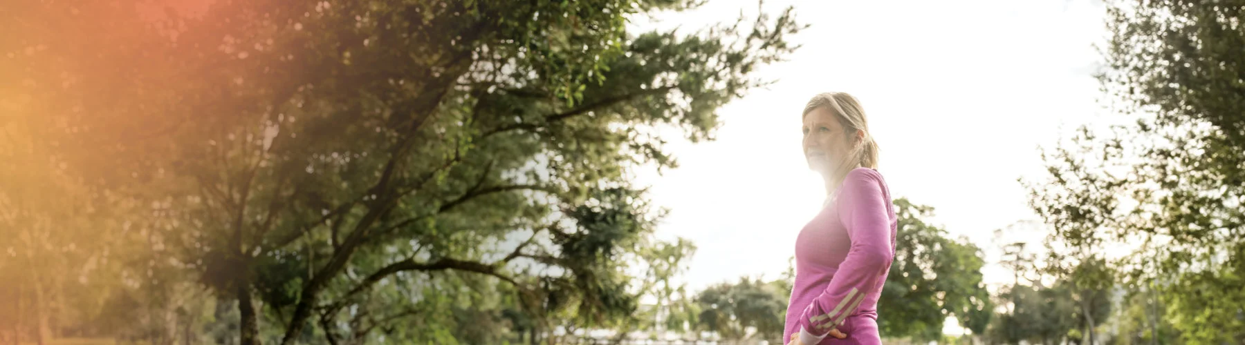 Woman in exercise gear taking a break